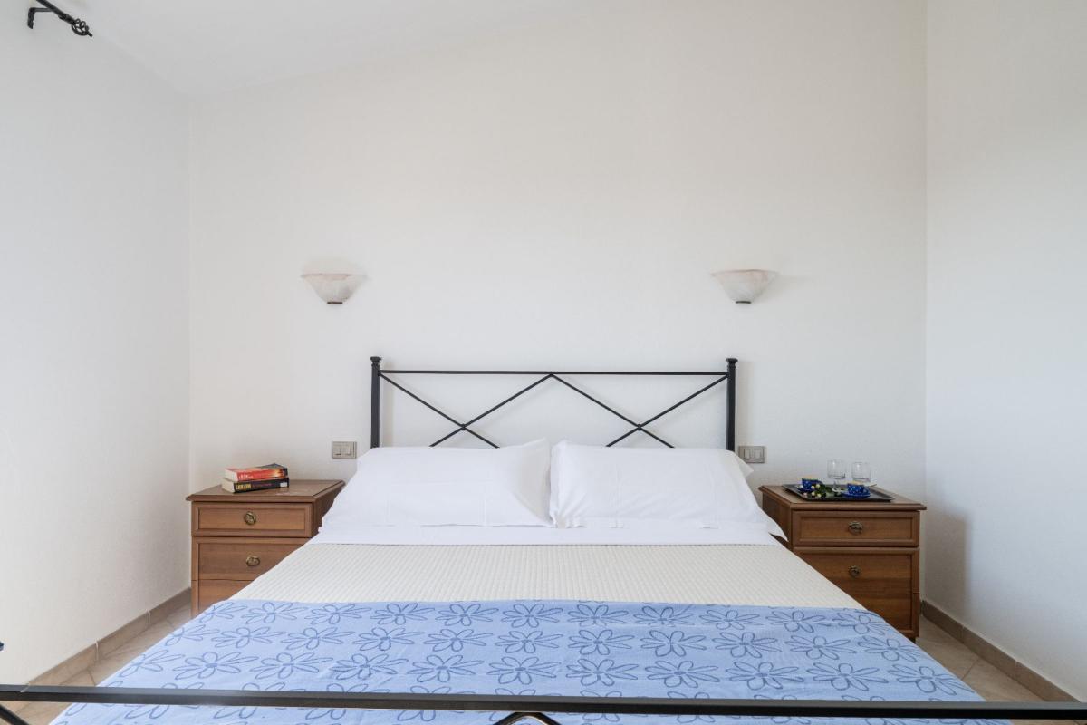 Nexus Hotels di Bini Viaggi S.R.L. Residence Oasi e Oasi Blu San Teodoro -  Sistemazione Trilo 4 BLU 1