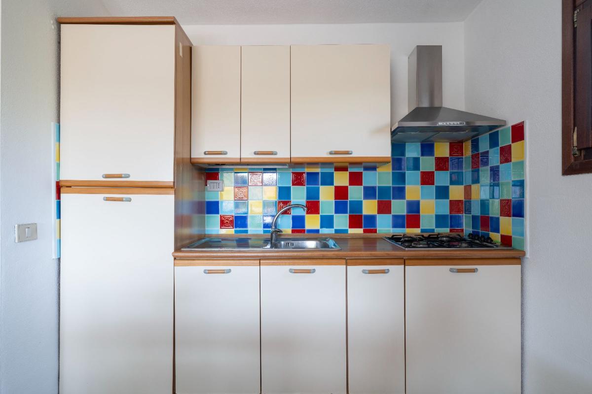 Nexus Hotels di Bini Viaggi S.R.L. Residence Oasi e Oasi Blu San Teodoro -  Sistemazione Trilo 4 BLU 1