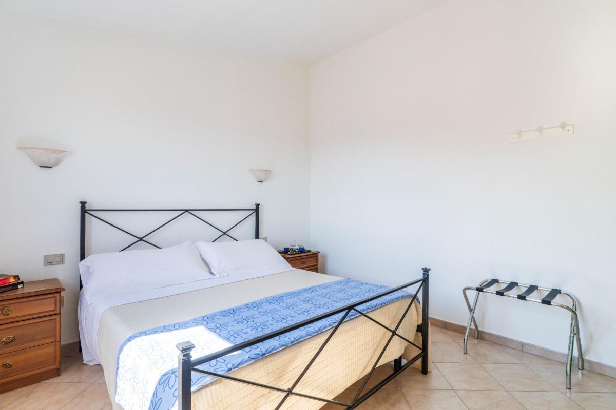 Nexus Hotels di Bini Viaggi S.R.L. Residence Oasi e Oasi Blu San Teodoro -  Sistemazione Trilo 6 BLU 1