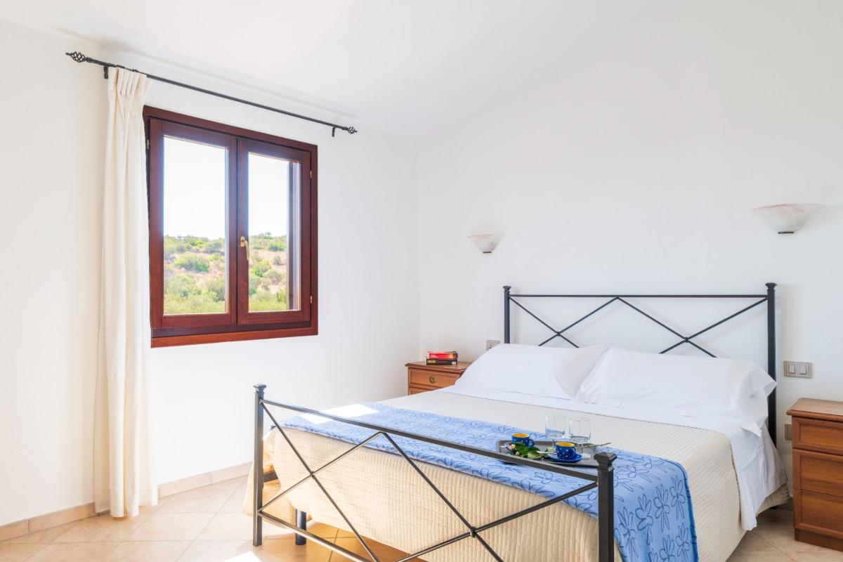 Nexus Hotels di Bini Viaggi S.R.L. Residence Oasi e Oasi Blu San Teodoro -  Sistemazione Trilo 6 BLU 1