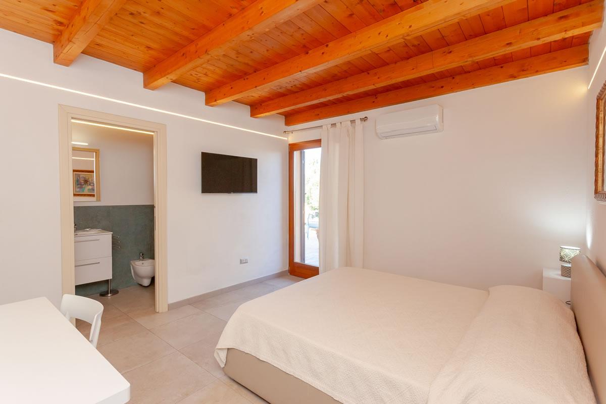 Residenze Pettirosso Pettirosso Center San Teodoro -  Camera Camera Deluxe 1
